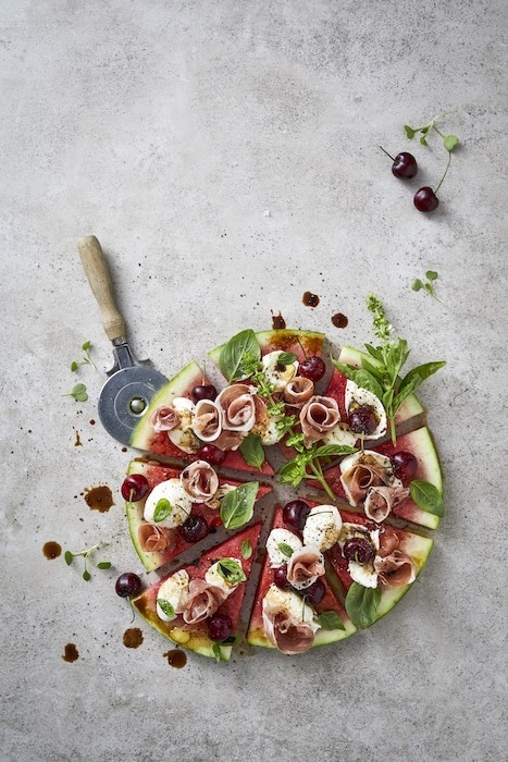 Watermelon ‘pizza’ with parma ham, mozzarella, cherries and basil