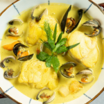 Blanquette de lotte et coquillages au curry